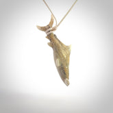 Winghead or hammerhead shark pendant. Hand carved from deer antler by NZ Pacific. Hand carved bone jewellery for sale online.